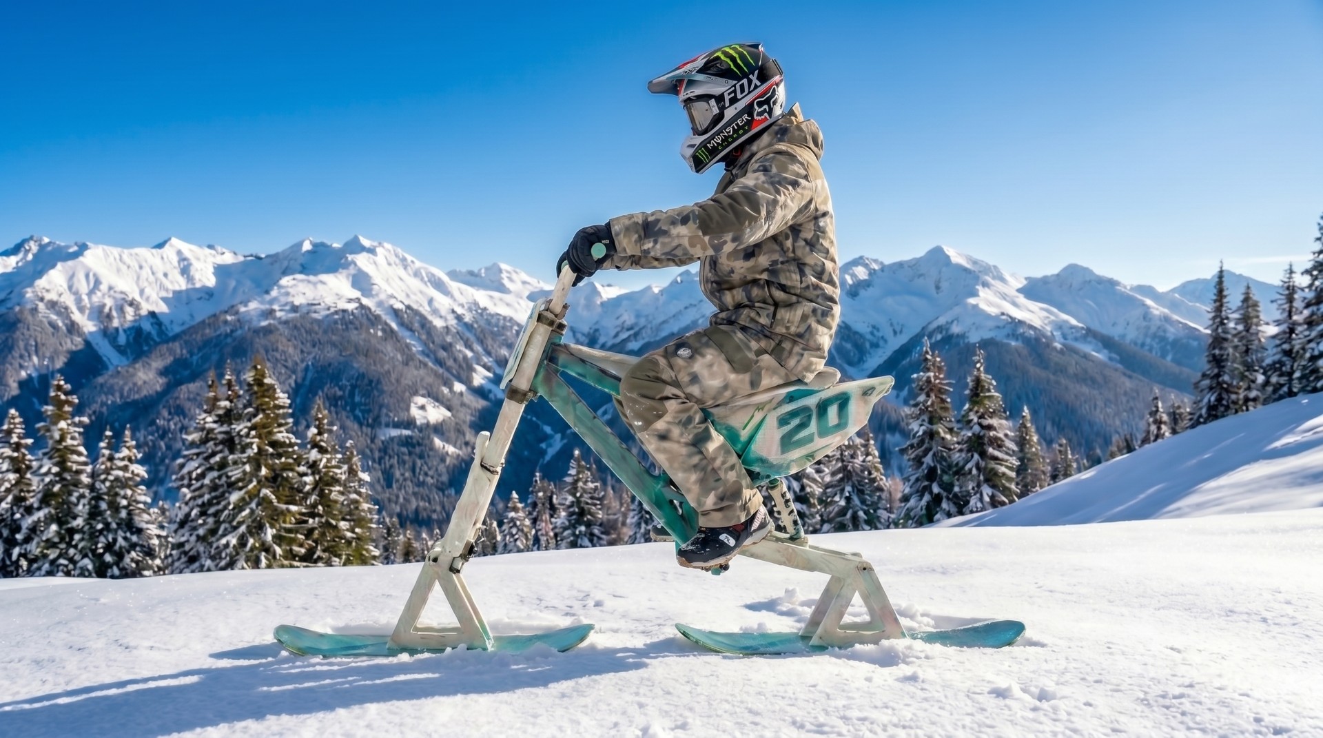 Rider carving down an alpine slope on a ski bike